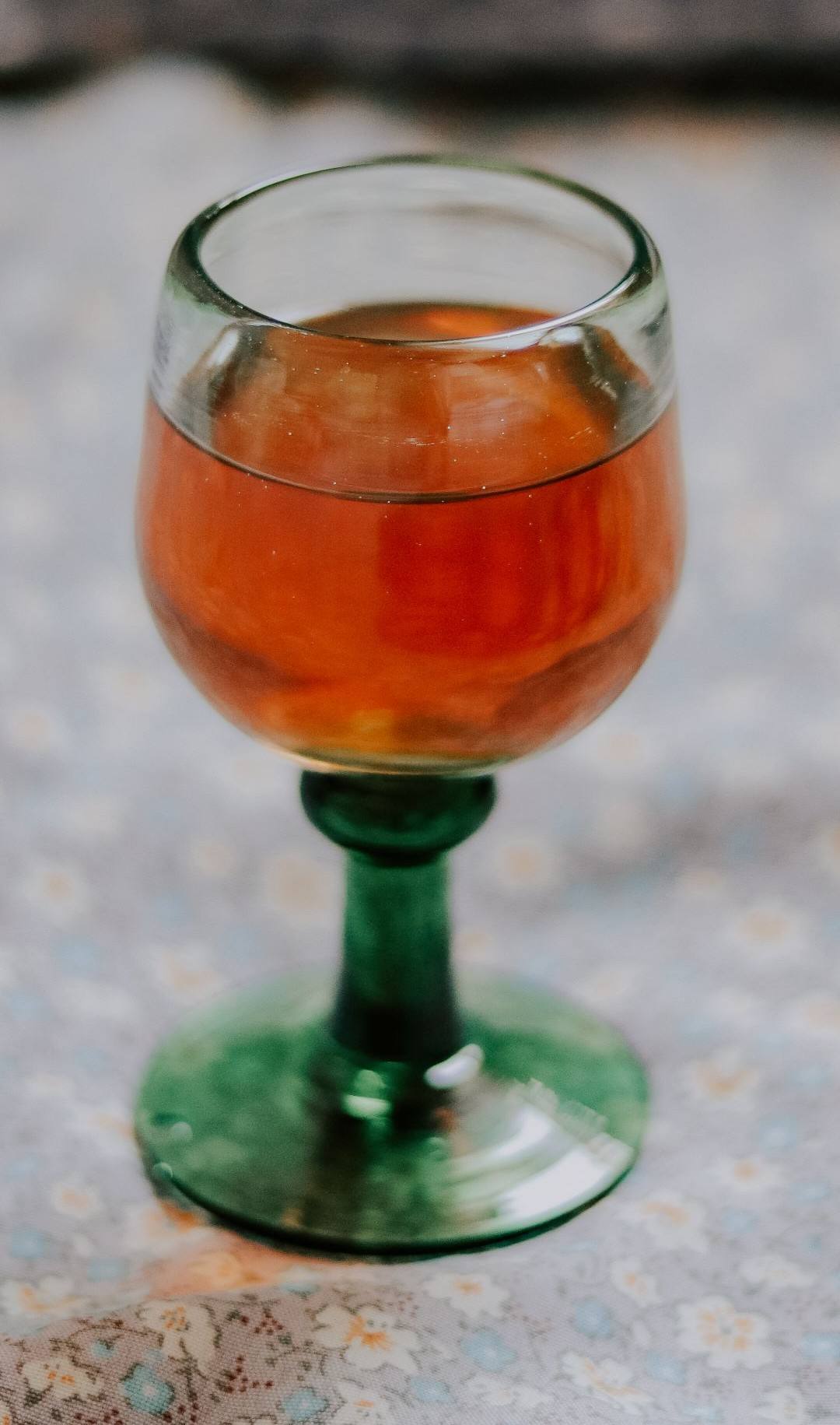 A glass of amber wine, close up